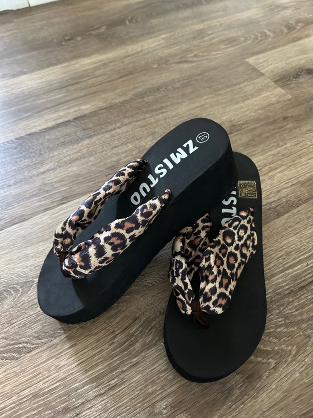 Cheetah print silky wedge thongs.